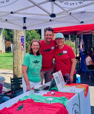 LSNA volunteers at the Tomato Art Fest tent wearing the red and green Lockeland Springs t-shirts