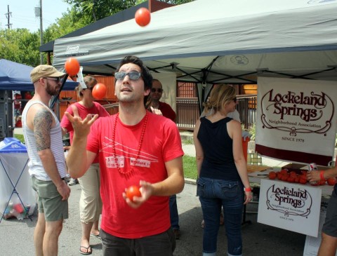 Board member Tony Gonzalez juggles some fruit, or is it a vegetable?